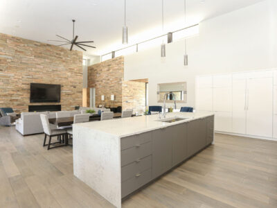 Kitchen Island Waterfall Edge Counter Top White Cabinet Storage Island Pendants High Ceilings Adjoining Living Room Elite Cabinets Tulsa Cabinet Designer