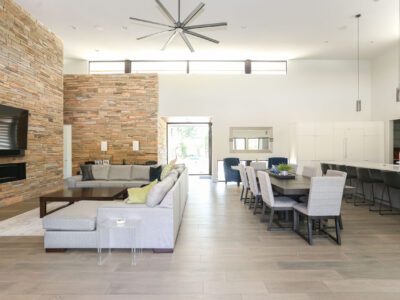 Large Kitchen Living Room Space Wood Floors Large Island Modern Fireplace High Ceilings Island Seating Pendant Lights Elite Cabinets Tulsa Kitchen Remodel