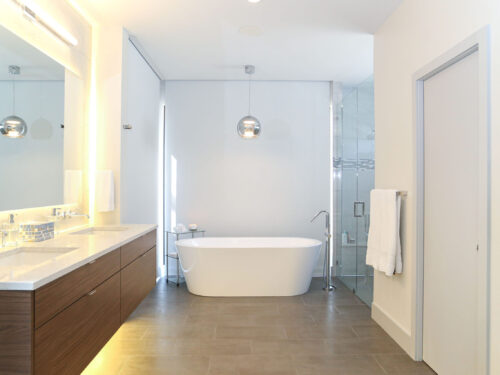 Master Bathroom Vanity Storage Wood Grain Drawer Storage Freestanding Tub Tile Flooring Decorative Pendant Light White Counter Top Elite Cabinets Tulsa Bathroom Design